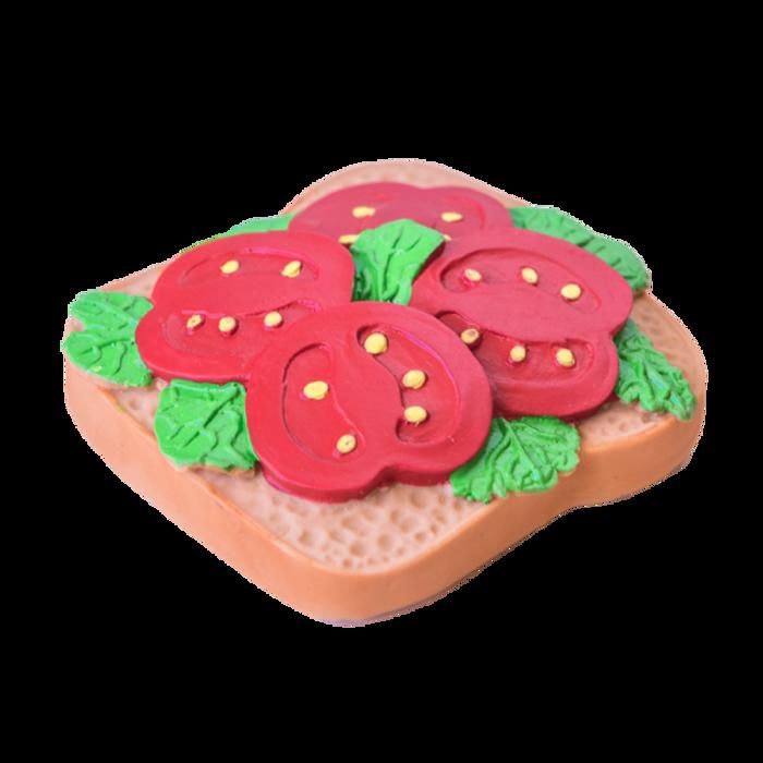 Anneau de dentition en caoutchouc grillé avec tomate