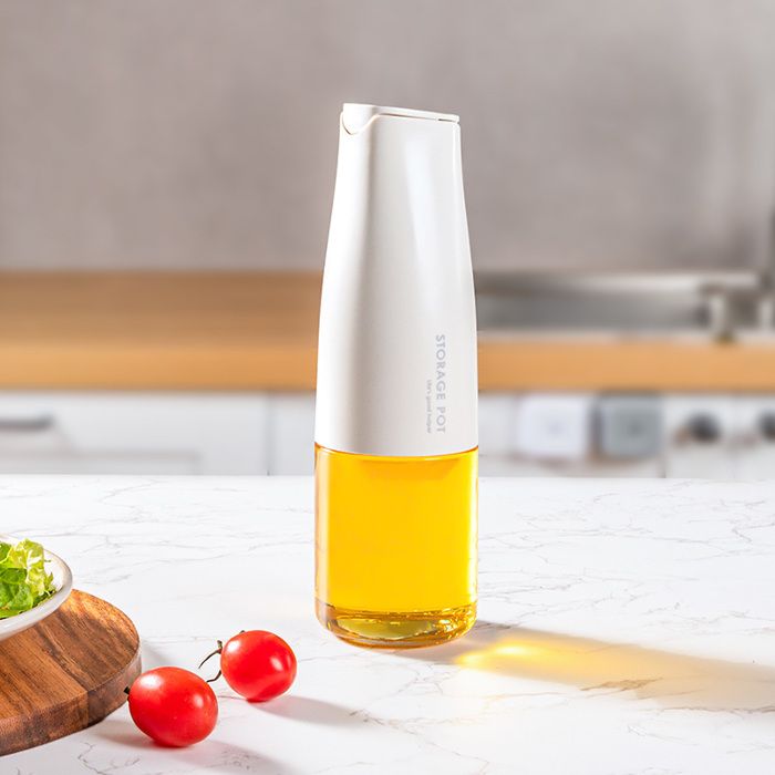 Bouteille à huile à ouverture/fermeture automatique